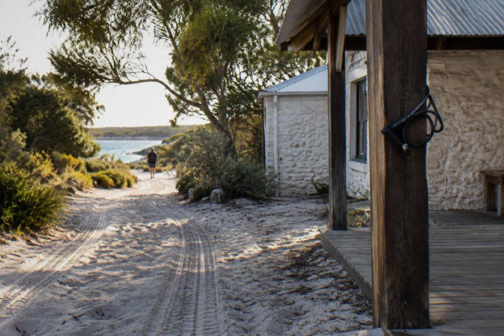 Bicycles parked on a sandy path near the Thomson Bay settlement