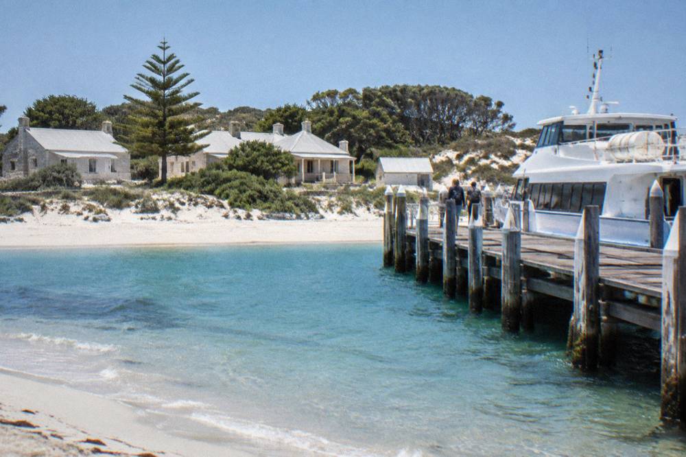 A ferry at the jetty in Thomson Bay with the settlement behind it