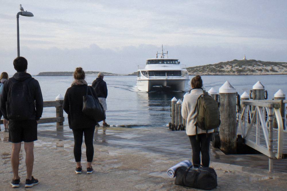 A ferry approaching the Main Jetty at Thomson Bay with passengers waiting on the platform