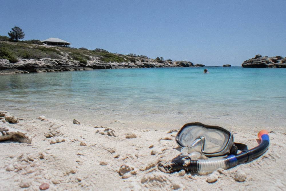 Sunny day over calm turquoise water at a sheltered Rottnest bay