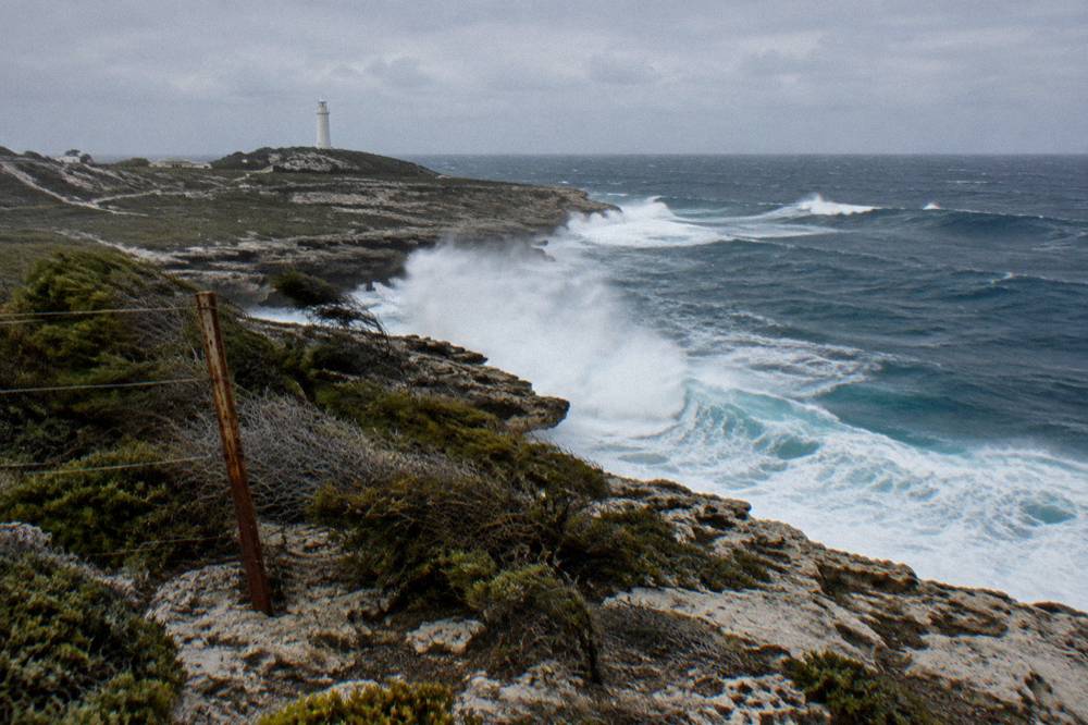 Waves breaking on rocky coastline at the western end of the island
